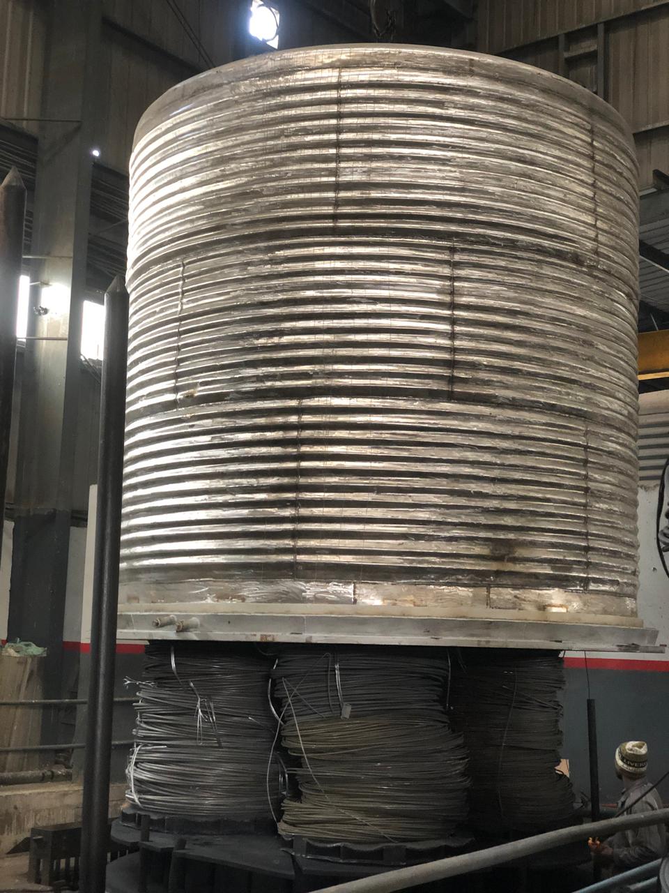 Inner cover lowered over wire rod coils